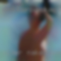 Older naked woman pissing