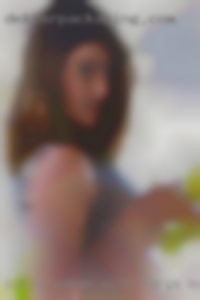 Curvy woman with large mature breasts.